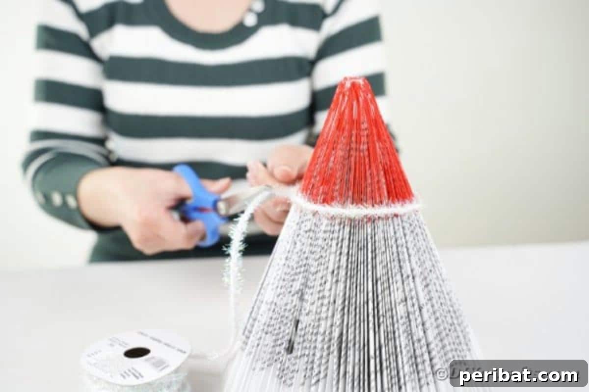 Adding ribbon around santa hat, illustrating the embellishment process