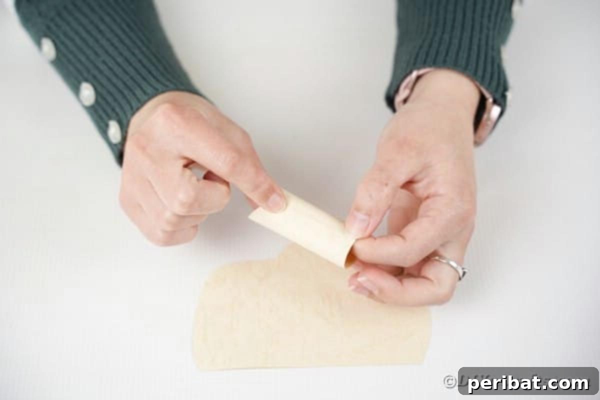 Making nose for Santa claus decor, illustrating the rolled paper nose