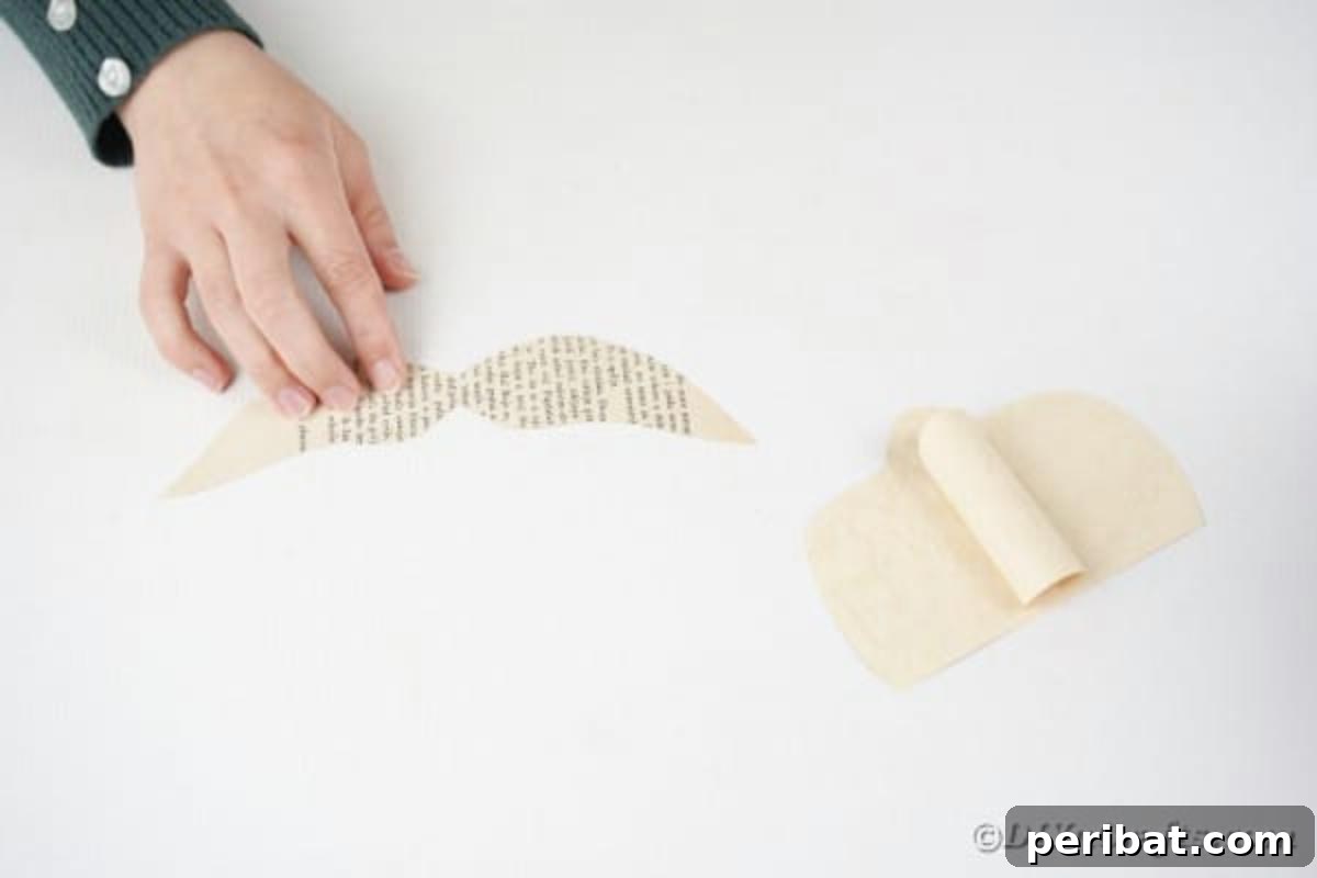 Making mustache for book santa, showing the curled paper mustache