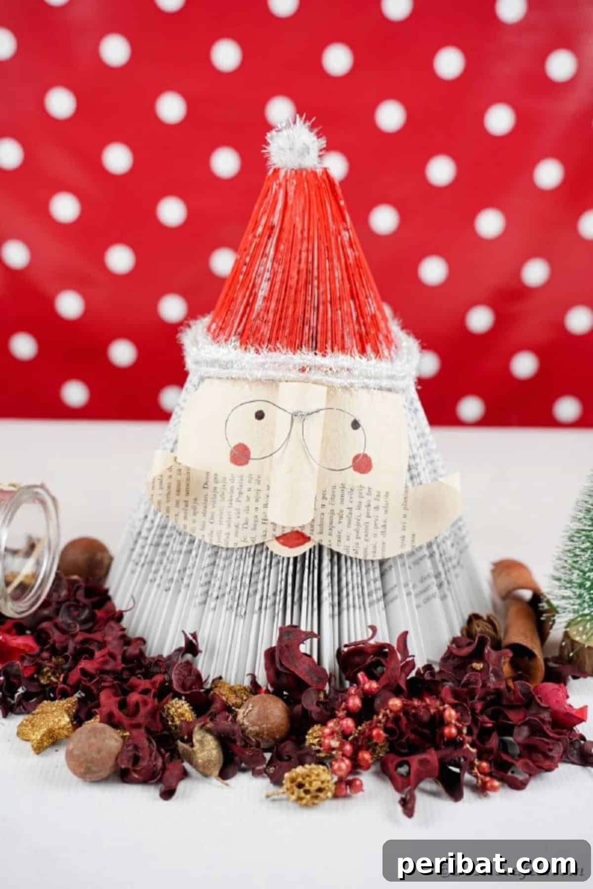 Book Santa Claus in front of red polka dot background, highlighting the festive backdrop