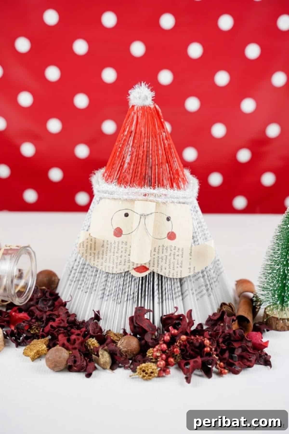 Book Santa Claus in front of red polka dot background, ready for display
