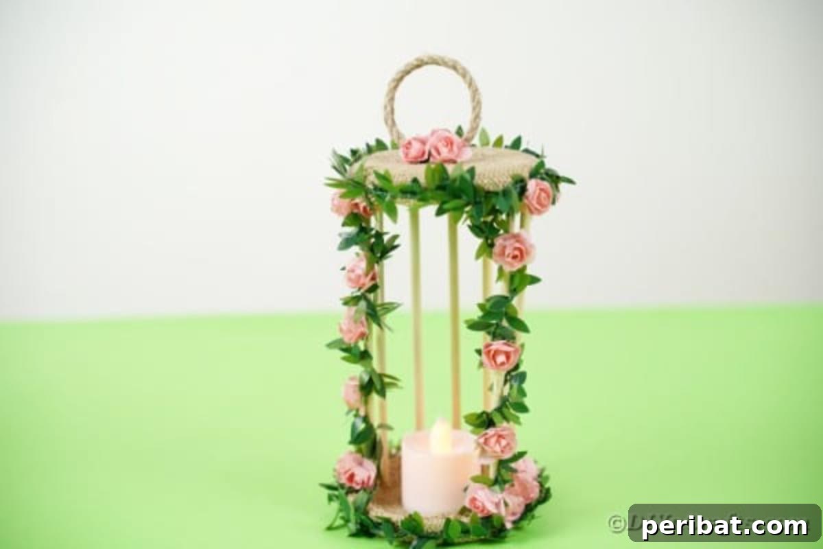Enchanted Garden Birdcage Luminary 6 Birdcage candle holder featuring floral accents, displayed on a green table, highlighting natural elements.