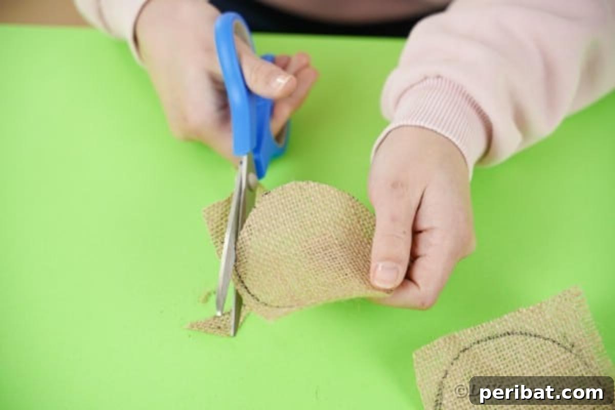 Enchanted Garden Birdcage Luminary 9 Cutting a burlap circle precisely with scissors.