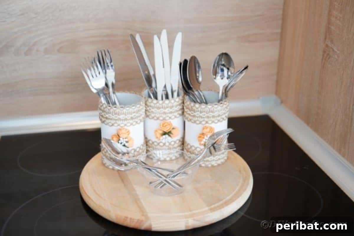 Farmhouse Storage from Repurposed Pringles Cans 5 Close-up of three Pringles can storage containers decorated with burlap and white flowers on a kitchen counter