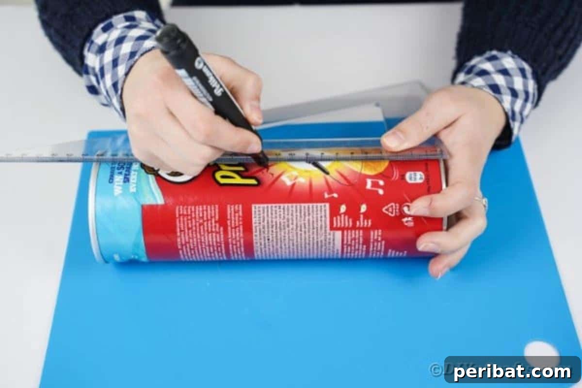 Farmhouse Storage from Repurposed Pringles Cans 8 Pringles can being measured with a ruler and marked with a pencil