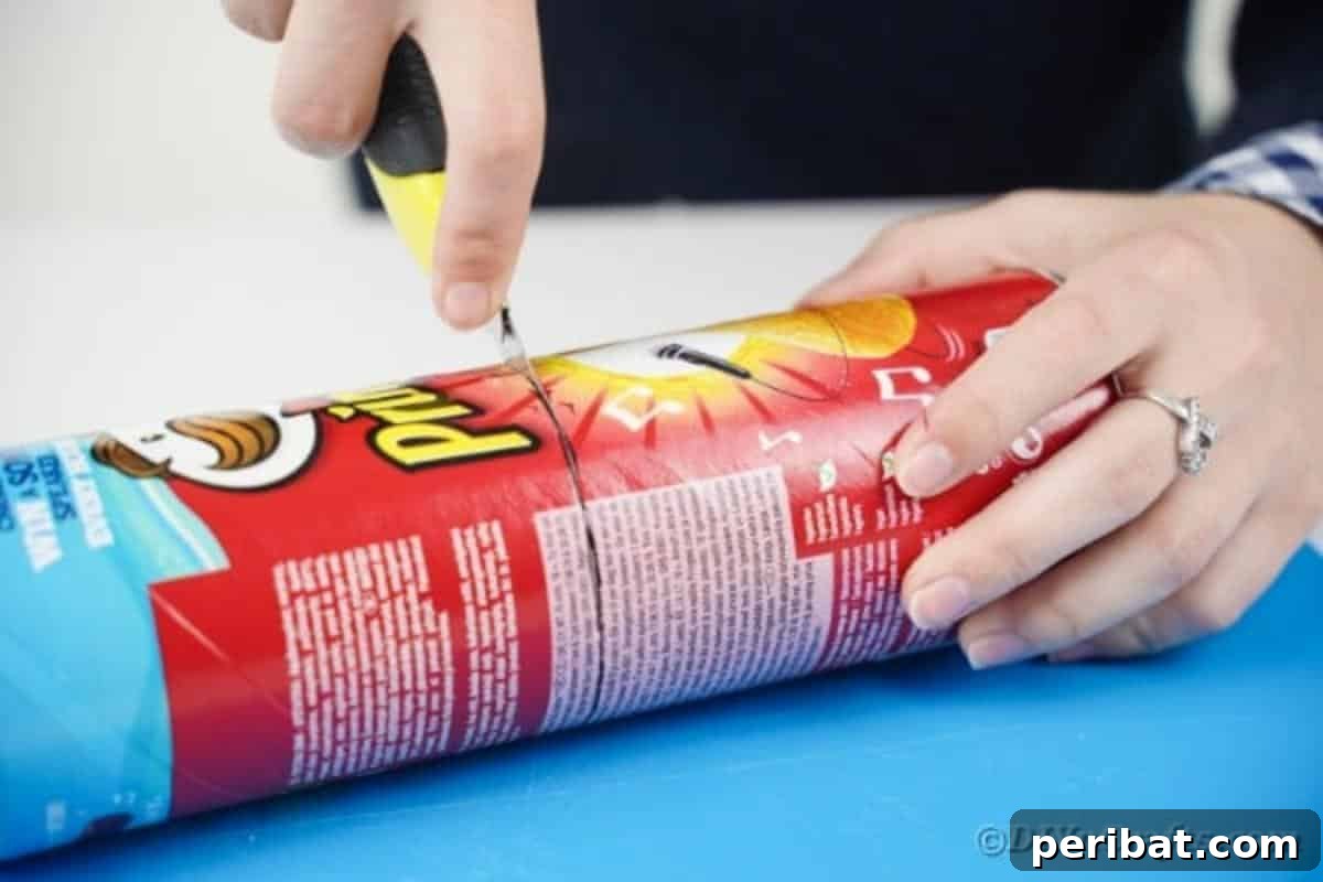 Farmhouse Storage from Repurposed Pringles Cans 9 Pringles can being cut with a craft knife along a marked line