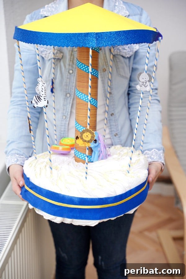 Whimsical Animal Carousel Diaper Cake 30 Woman holding a finished animal-themed carousel diaper cake