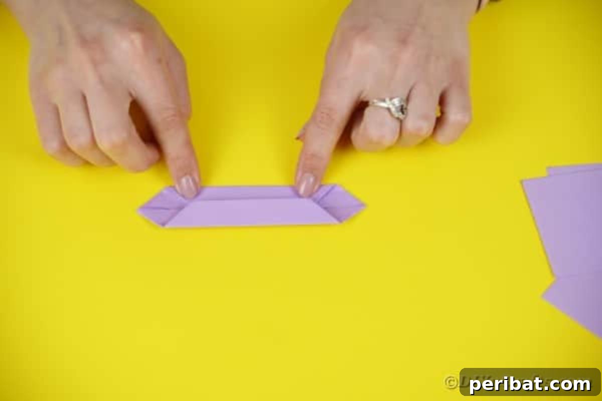 Purple paper folded inward, creating a more defined shape.