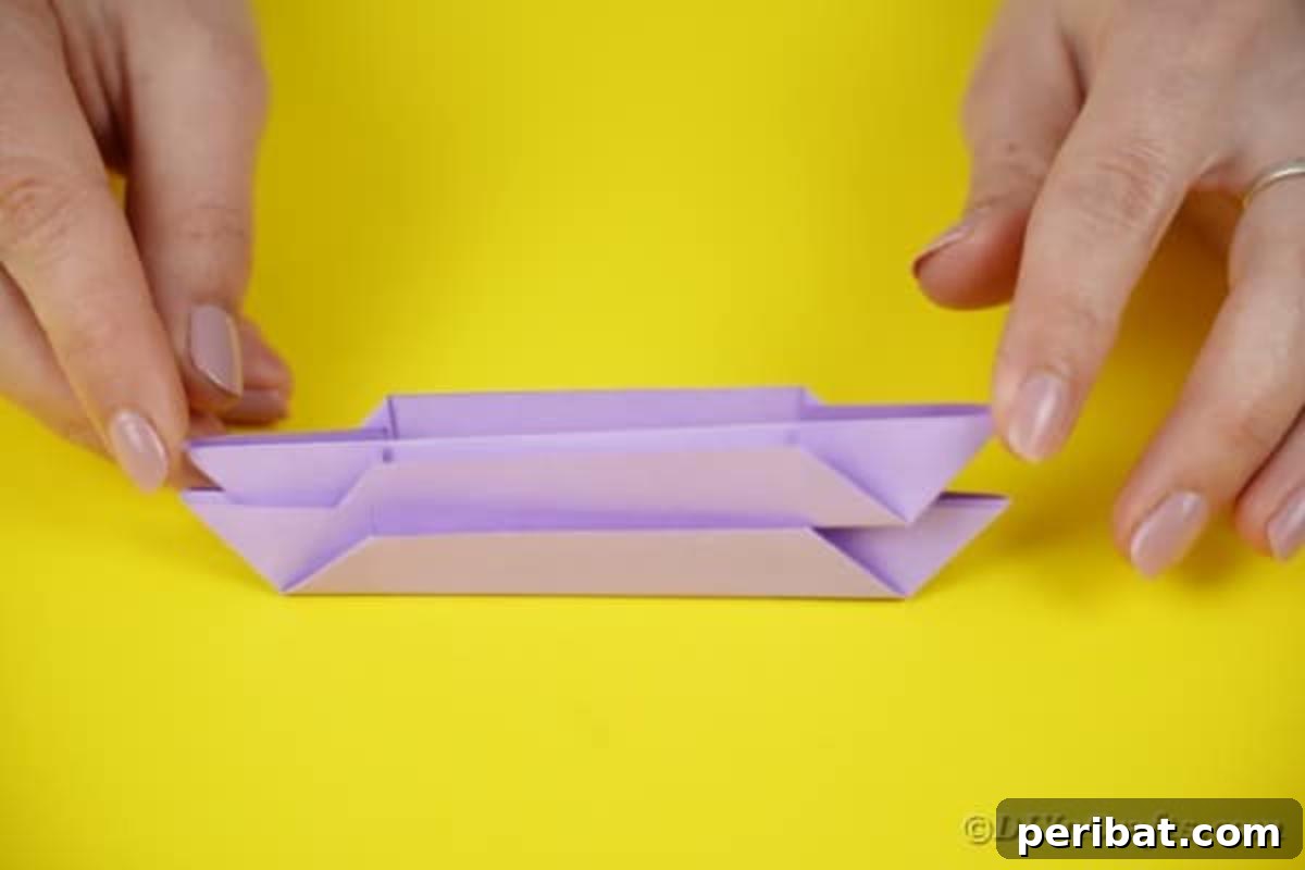 Stacked and doubled purple paper segments.