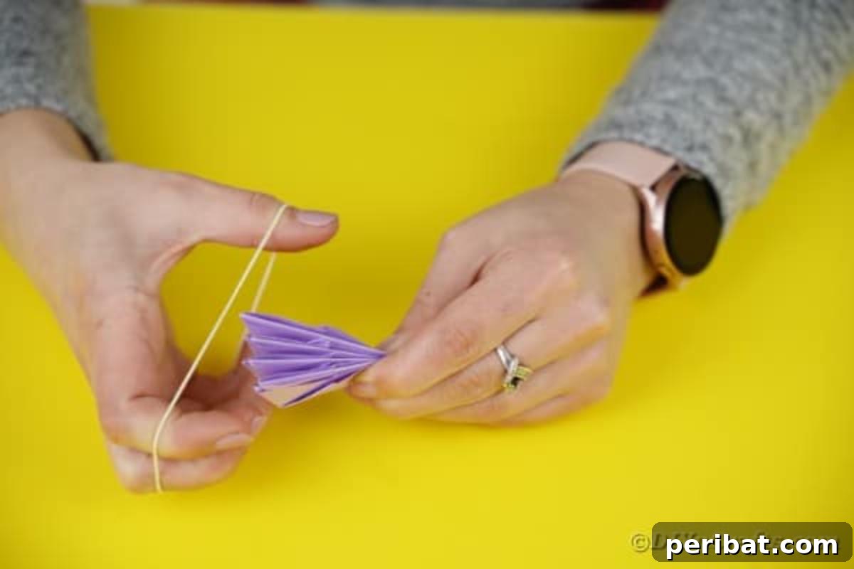 Four doubled paper segments secured in the center with a twist tie.