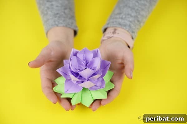 Woman holding paper lotus