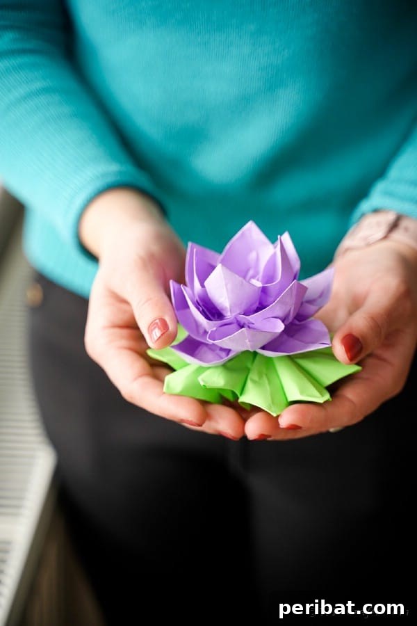 Woman holding paper lotus