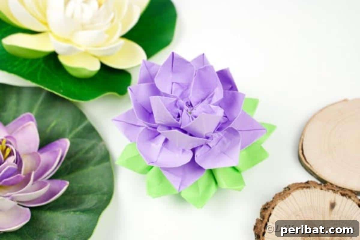A purple paper lotus flower elegantly sits amidst a collection of colorful paper sheets, ready for crafting.
