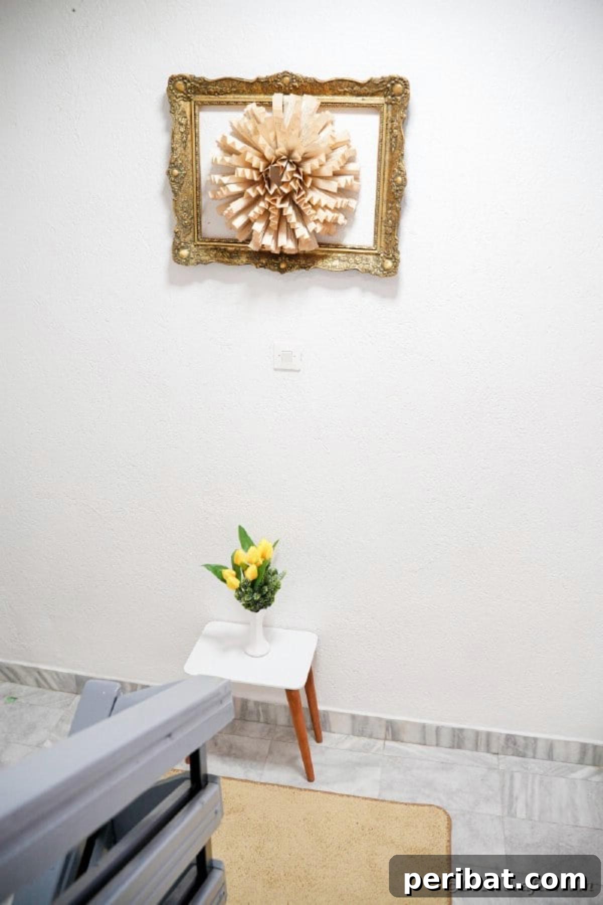 Close-up of the elegant paper flower wall art made from old book pages, highlighting its textured details