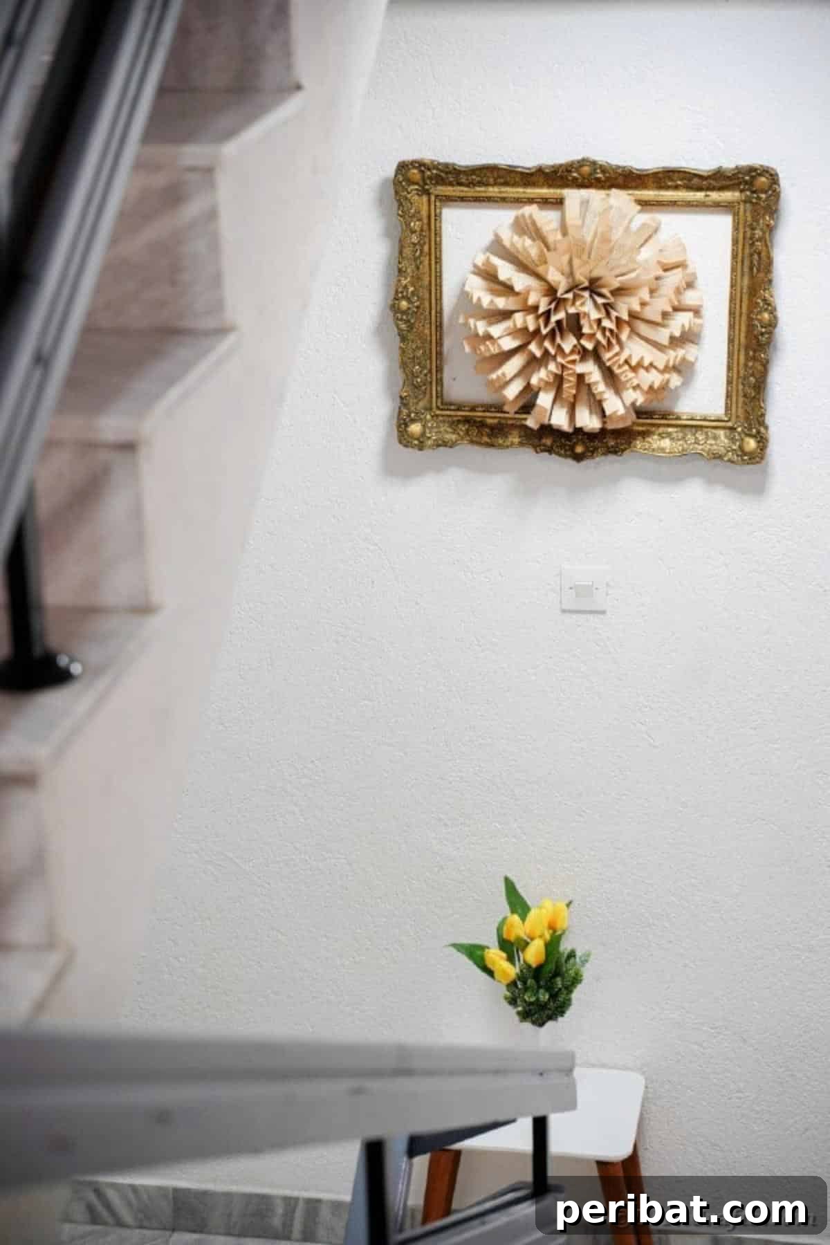 Another view of the beautifully crafted paper flower wall art, showcasing its integration into a home setting