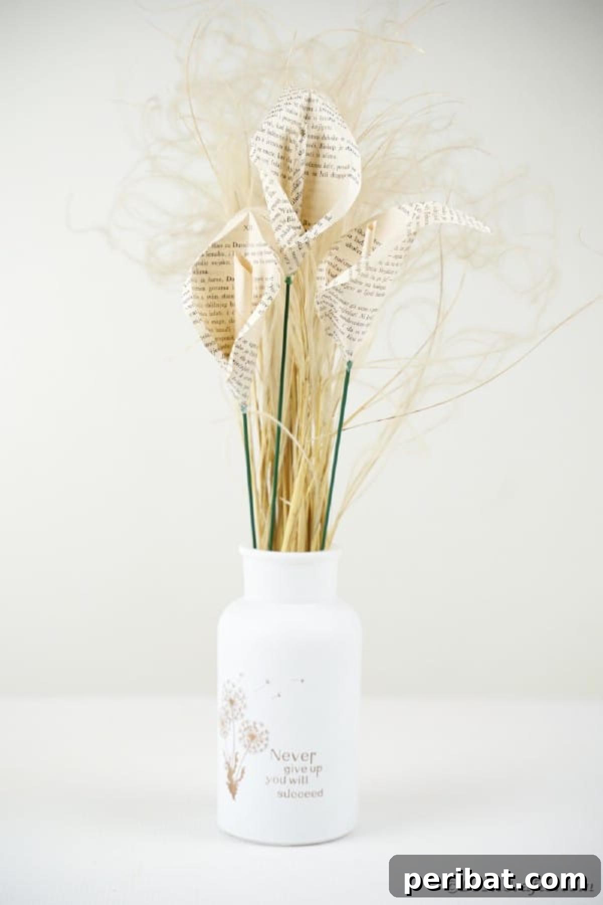 Whispering Pages Calla Lily Bouquet 18 Calla lilies in vase in front of white background
