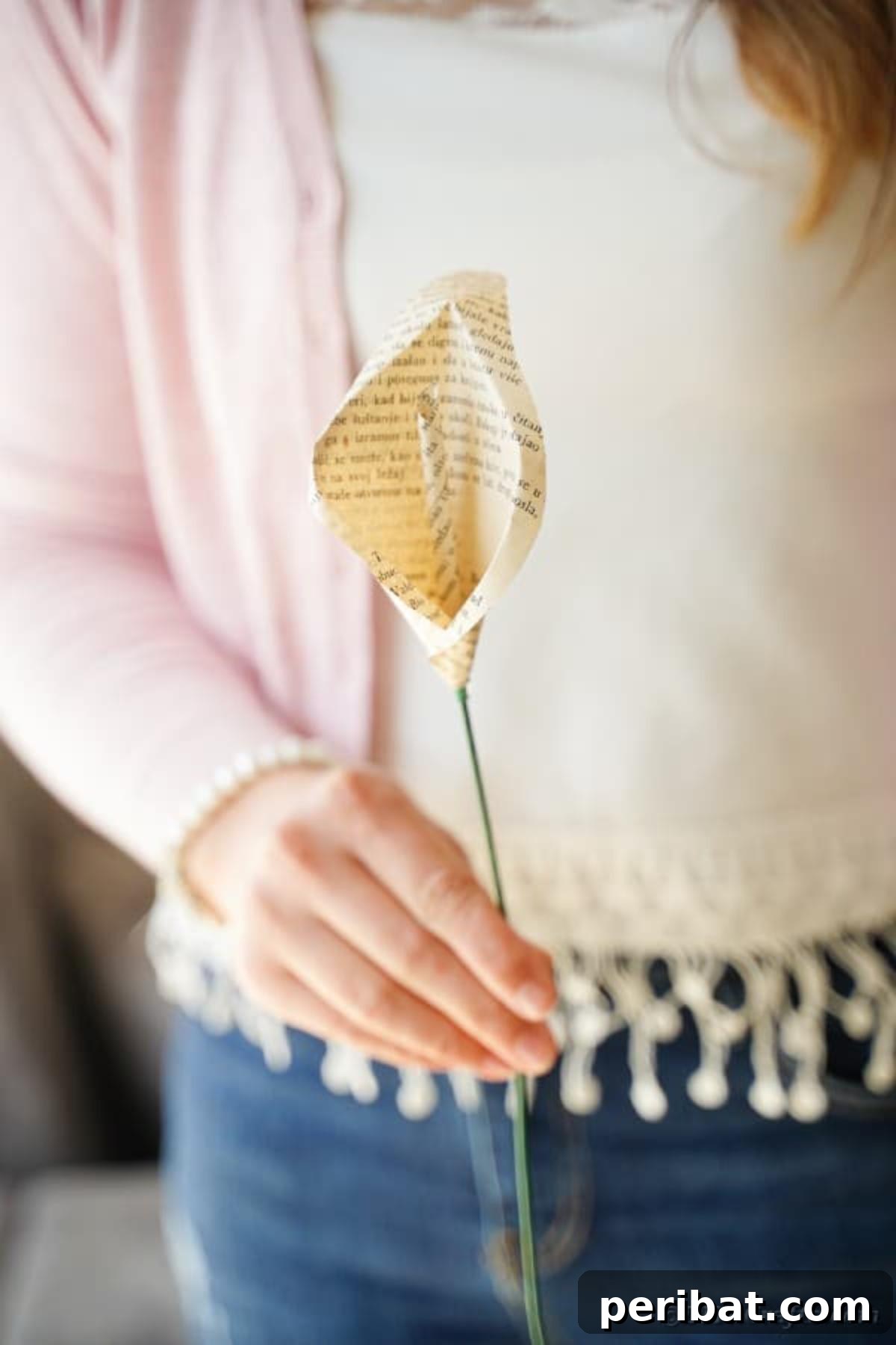 Whispering Pages Calla Lily Bouquet 34 Woman holding book page calla lily