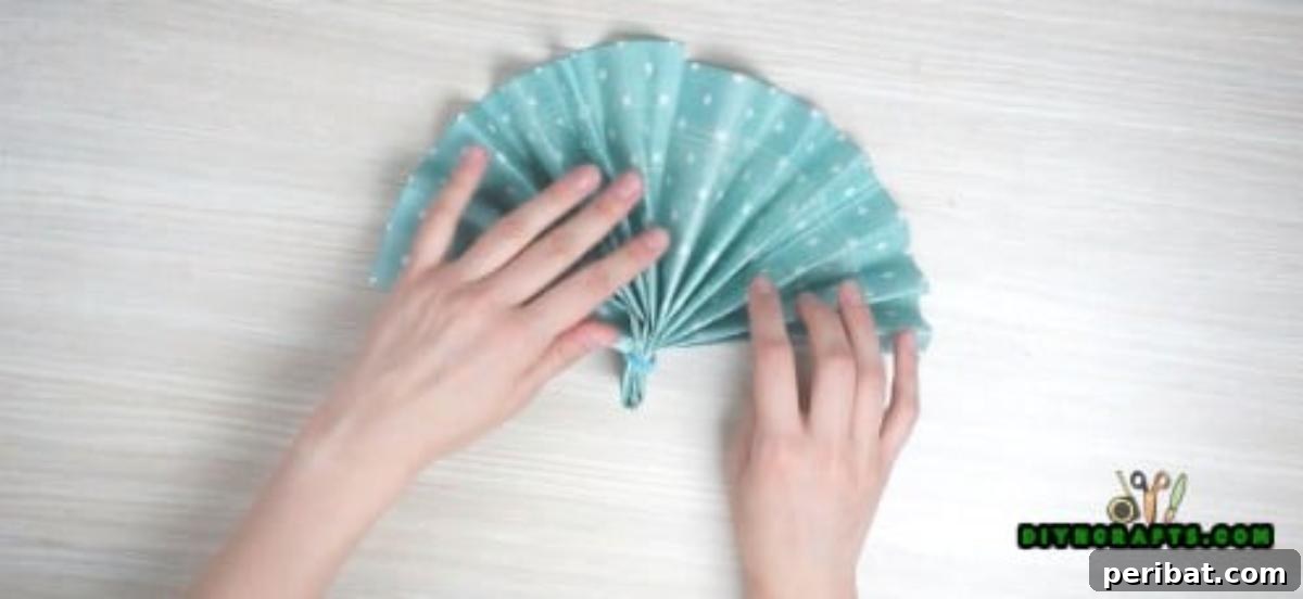 5 Instant Napkin Folds to Amaze Your Guests 20 Fan Napkin Step 4: Spreading Open and Securing with Ring