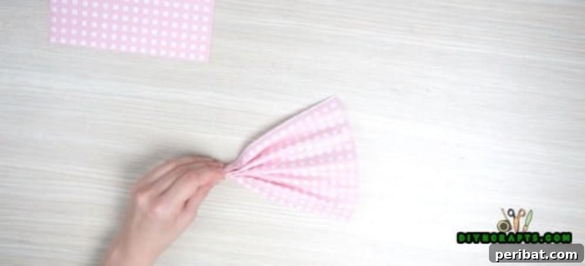 5 Instant Napkin Folds to Amaze Your Guests 22 Dress Napkin Step 2: Creating the Skirt with a Pleated Napkin and Pipe Cleaner
