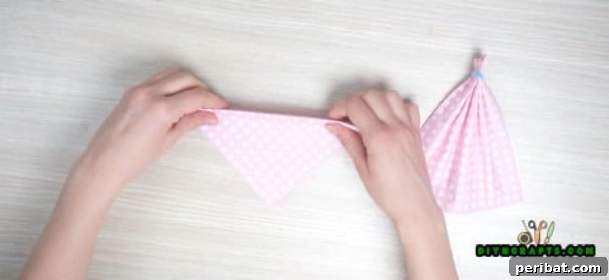 5 Instant Napkin Folds to Amaze Your Guests 25 Dress Napkin Step 4: Folding Up Base for Neckline Prep
