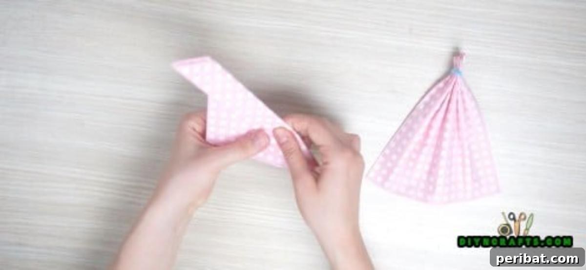 5 Instant Napkin Folds to Amaze Your Guests 26 Dress Napkin Step 4 Detail: Initial Neckline Fold