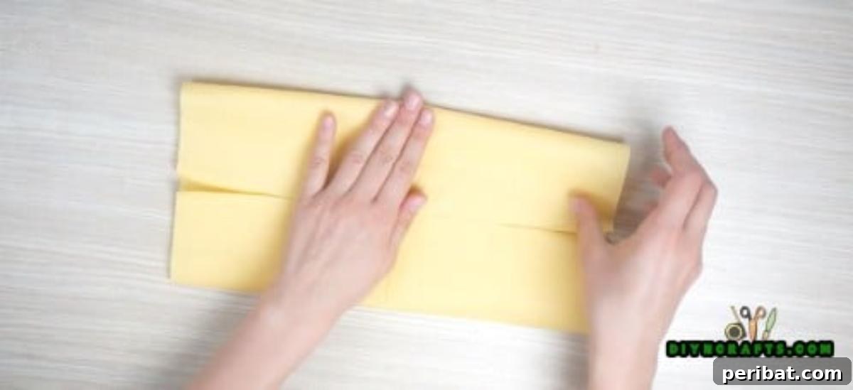 5 Instant Napkin Folds to Amaze Your Guests 33 Shirt Napkin Step 3: Folding Top Half to Center
