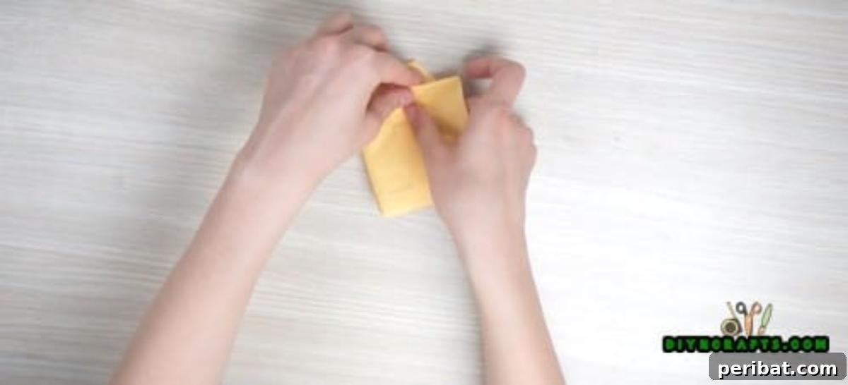5 Instant Napkin Folds to Amaze Your Guests 39 Shirt Napkin Step 9: Folding Bottom Up Again to Form Shirt Body