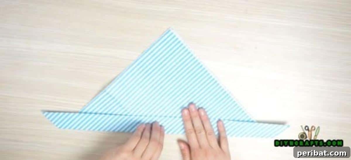 5 Instant Napkin Folds to Amaze Your Guests 5 Fish Napkin Step 3 Detail: Creating the Tail Fold
