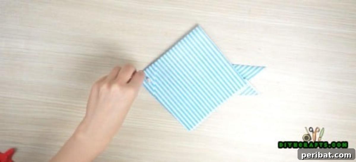 5 Instant Napkin Folds to Amaze Your Guests 8 Fish Napkin Step 6: Adding the Eye and Embellishments